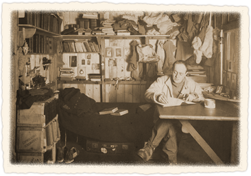 Captain Scott writing at his desk