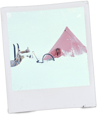A pyramid tent during a whiteout
